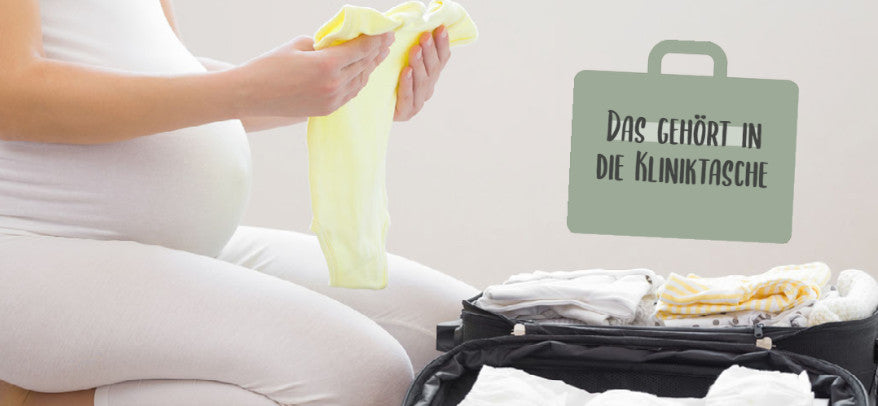 Schwangere Frau packt Koffer für den Krankenhausaufenthalt